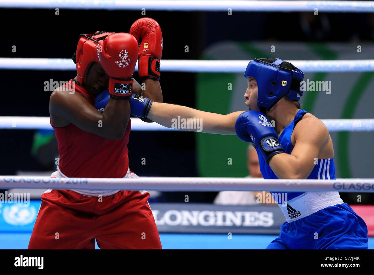 Wales' Lauren Price (right) in action against Guyana's Theresa London in the Women's Middle round of 16 match at the SECC, during the 2014 Commonwealth Games in Glasgow. Stock Photo