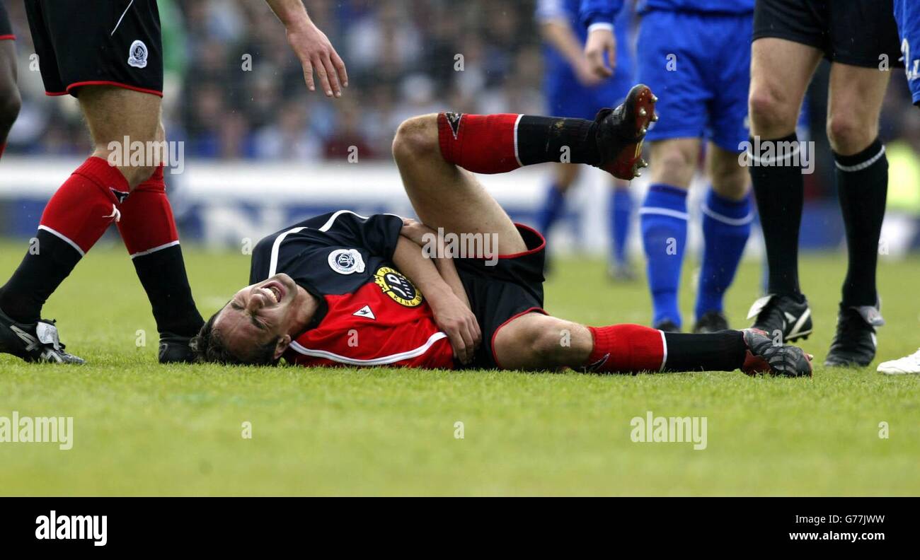 Queens Park Rangers' Matthew Rose goes doewn injured against Oldham during their Nationwide Division Two league semi-final 1st leg match at Boundary Park, Oldham. NO UNOFFICIAL CLUB WEBSITE USE. Stock Photo
