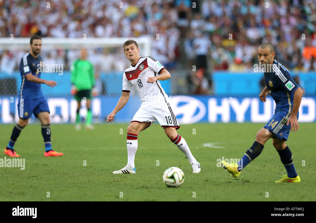 Soccer - FIFA World Cup 2014 - Final - Germany v Argentina - Estadio do Maracana. Germany's Toni Kroos (centre) in action against Argentina Stock Photo
