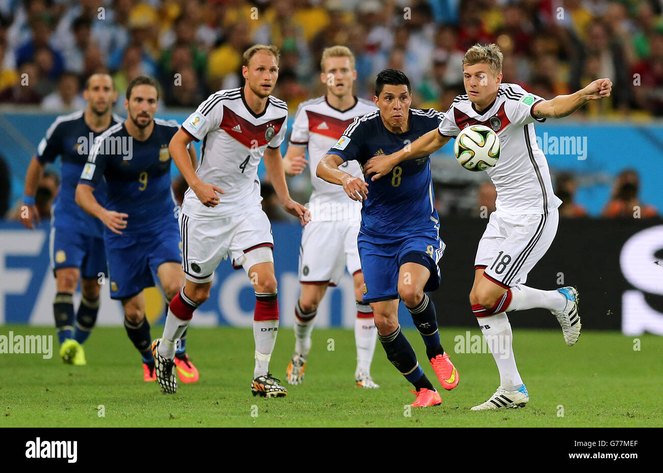 Germany's Toni Kroos (right) battles for the ball with Argentina's Enzo Perez (second right) Stock Photo