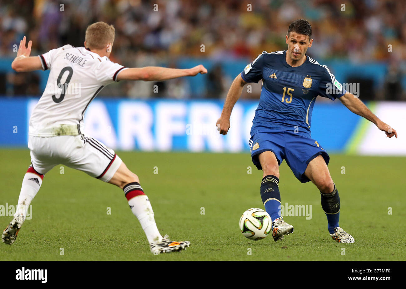Argentina's Martin Demichelis in action with Germany's Andre Schurrle (left) Stock Photo