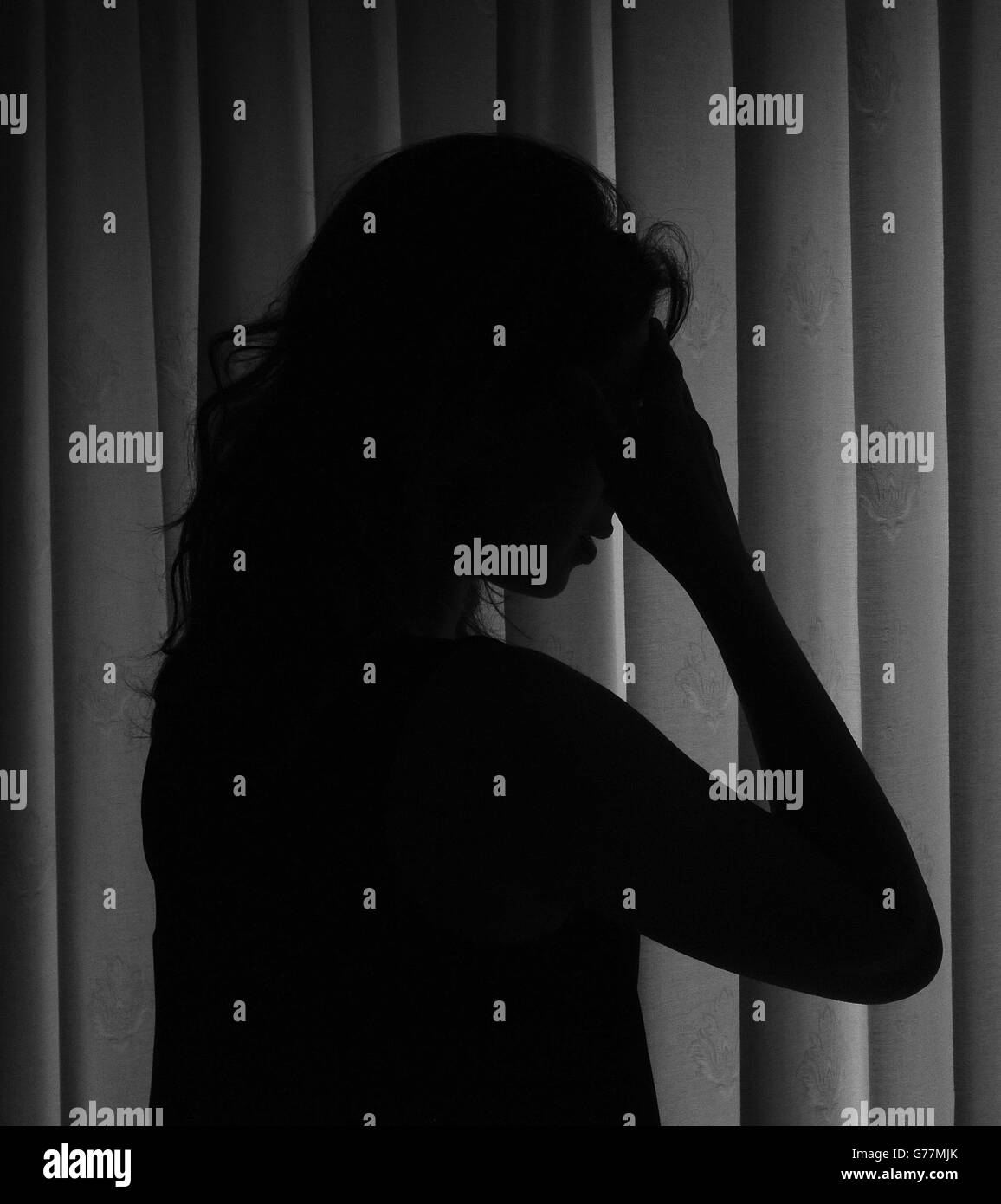 Picture posed by model a woman showing signs of depression hires stock