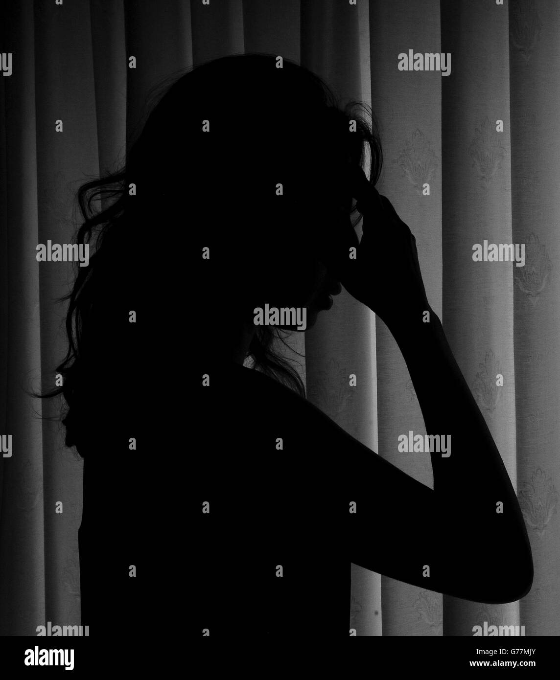 Picture posed by model a woman showing signs of depression hires stock