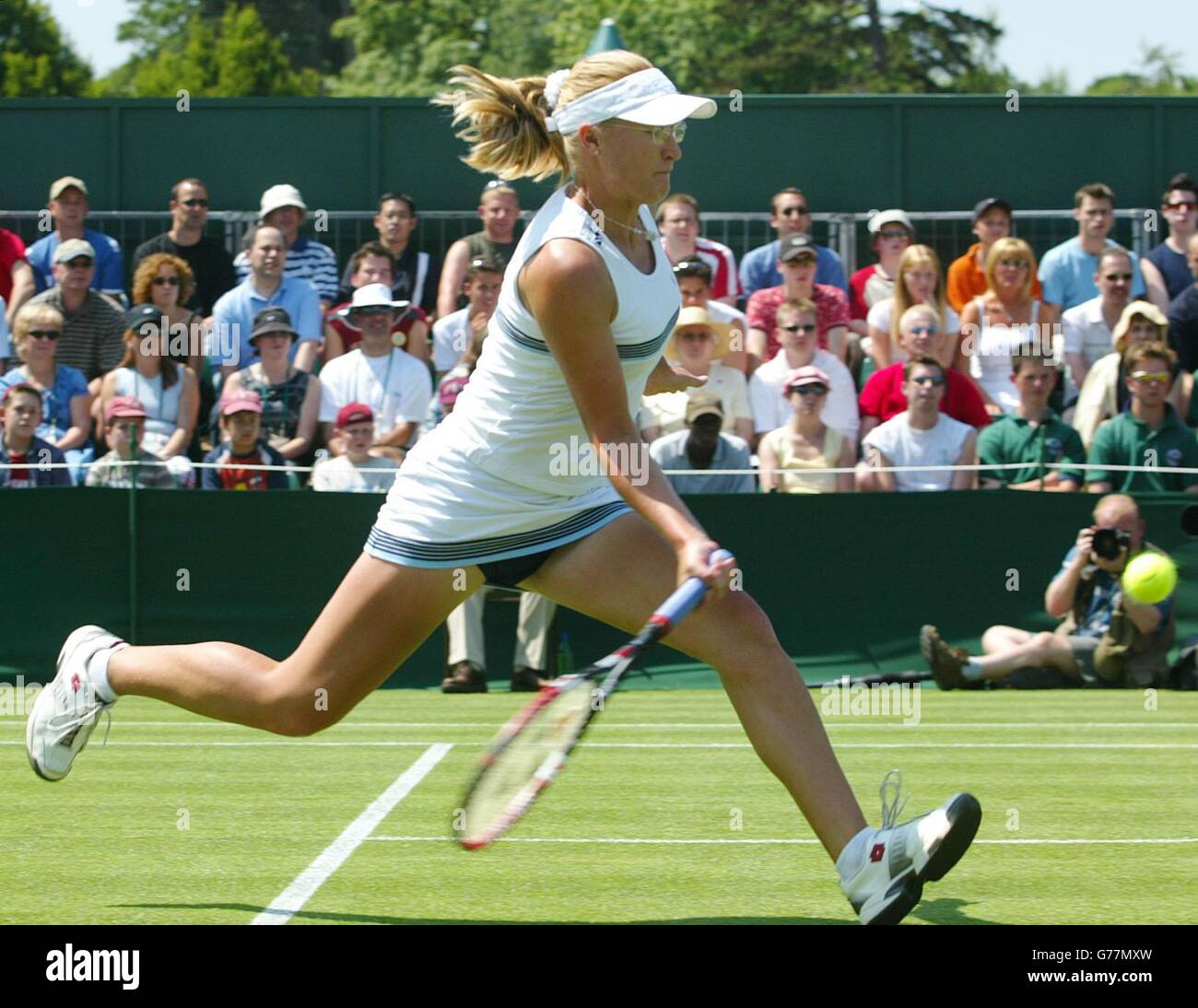 Britain's Elena Baltacha in action against Jelena Dokic of Serbia Montenegro at the All England Lawn Tennis Championships in Wimbledon. Stock Photo