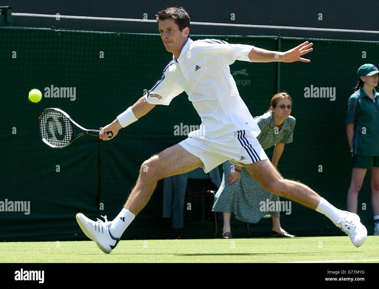 , NO MOBILE PHONE USE. British tennis star Tim Henman in action against Tomas Zib of the Czech Republic on Court One at the All England Lawn Tennis Championships in Wimbledon. Stock Photo