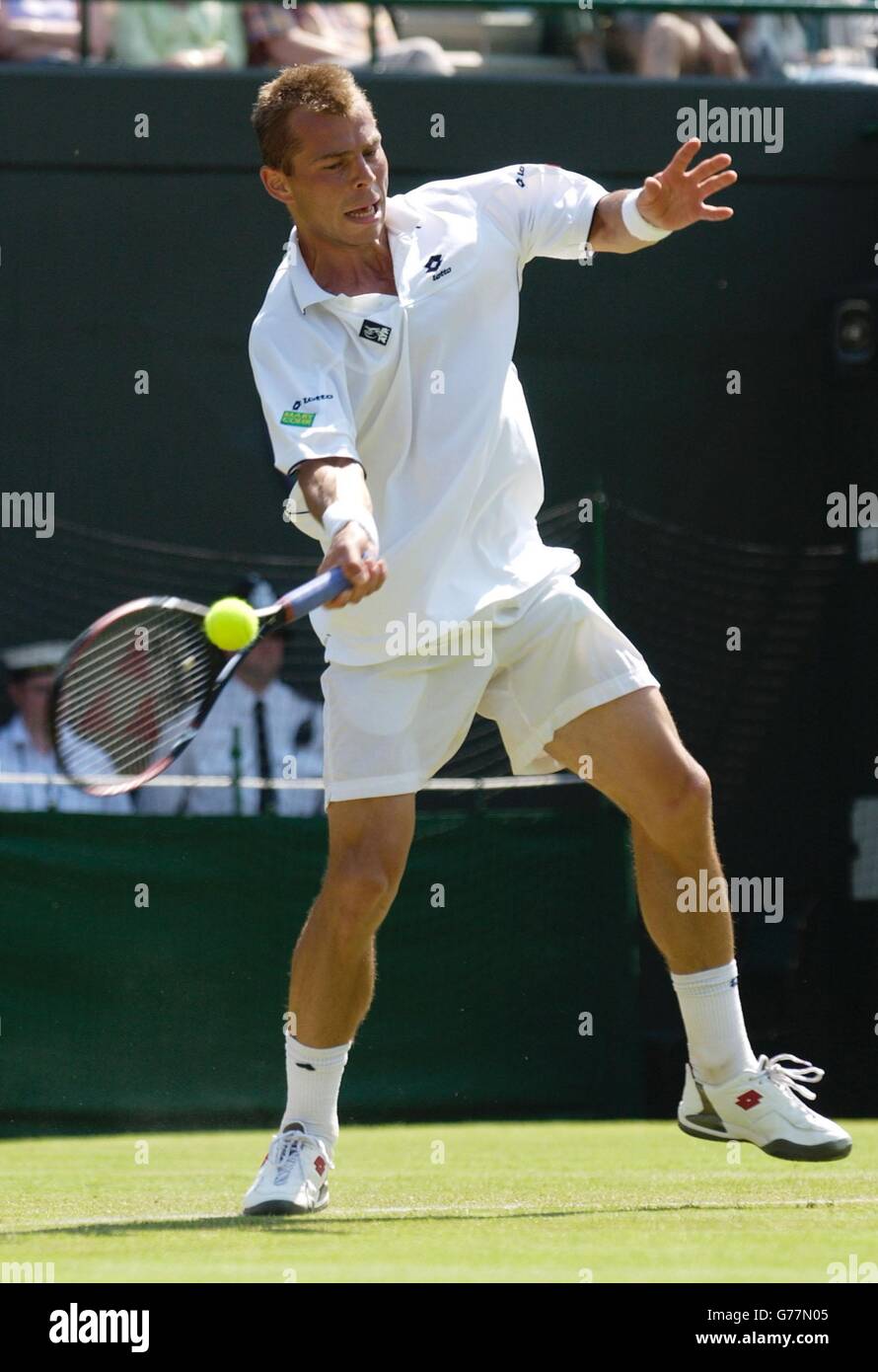 , NO MOBILE PHONE USE. Tomas Zib of the Czech Republic in action against British tennis star Tim Henman at the All England Lawn Tennis Championships in Wimbledon. Stock Photo