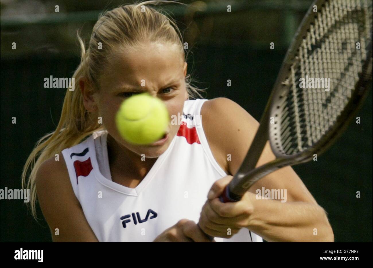 EDITORIAL USE ONLY, NO MOBILE PHONE USE : Jelena Dokic from Serbia and Montenegro in action against Emmanuelle Gagliardi from Switzerland at the All England Lawn Tennis Championships. Dokic won in straight sets 6:1/6:3. Stock Photo