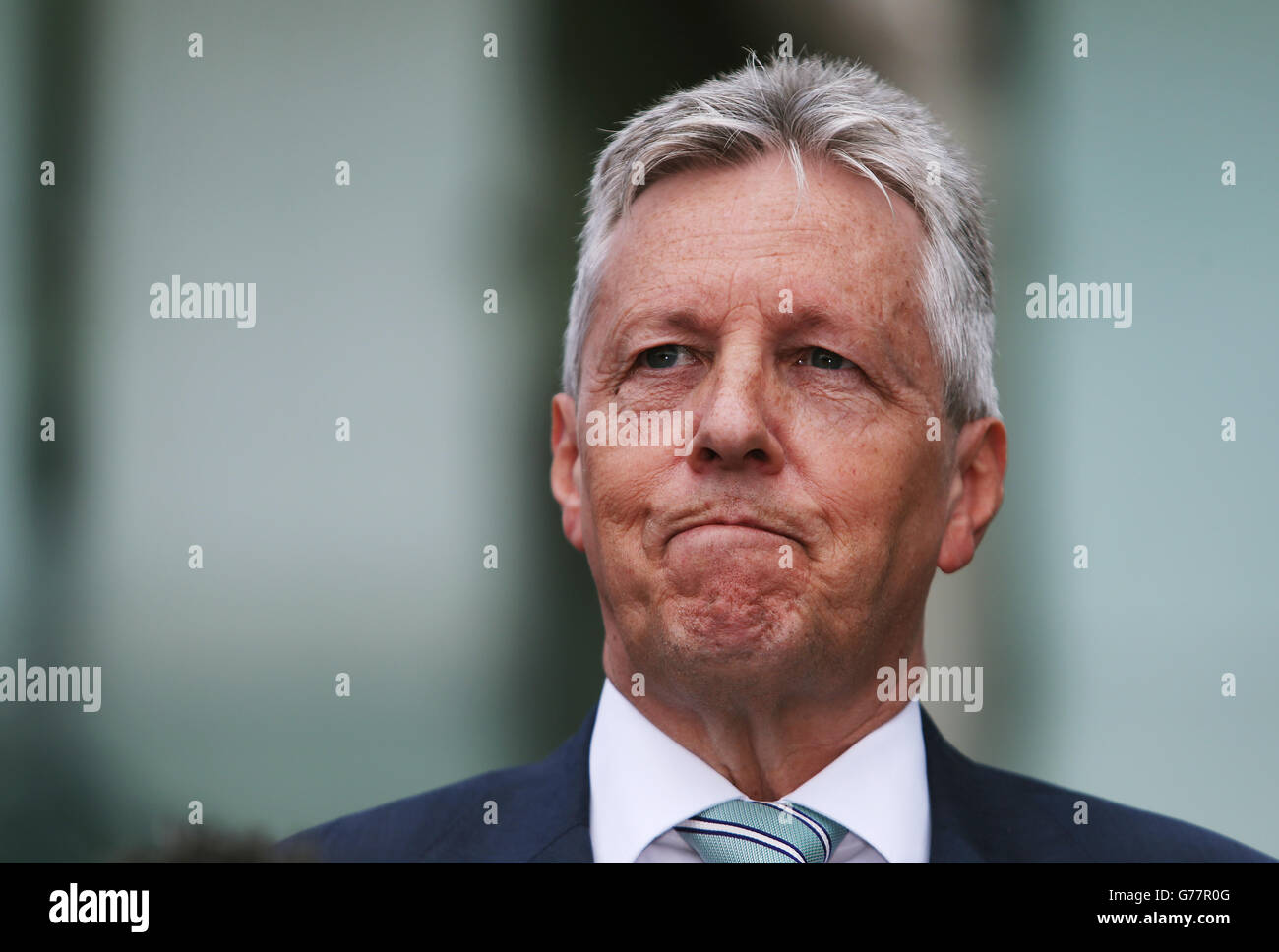 First Minister Peter Robinson speaks to the media outside the Stormont Hotel, Belfast, following the publishing of the Hallet Review into controversial amnesties for on the run prisoners from Northern Ireland. Stock Photo