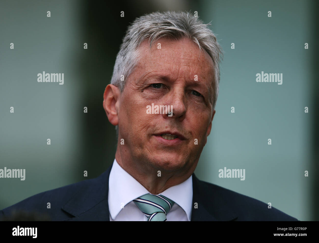 First Minister Peter Robinson speaks to the media outside the Stormont Hotel, Belfast, following the publishing of the Hallet Review into controversial amnesties for on the run prisoners from Northern Ireland. Stock Photo