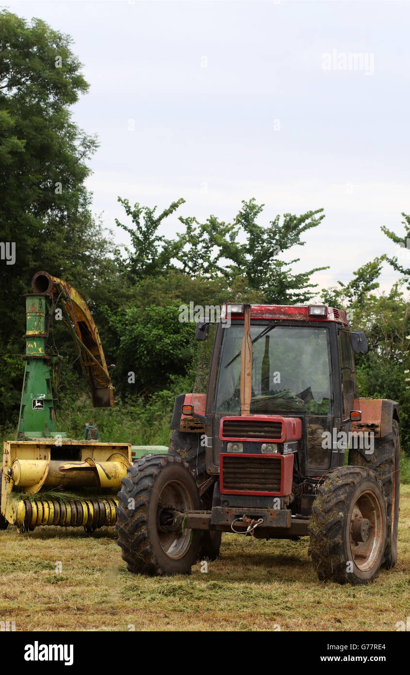 Case farm tractor and a John Deere machine near Sandford in Somerset
