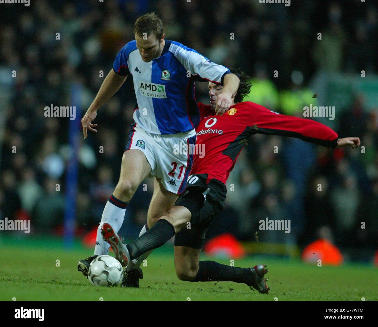 Blackburn Rovers Martin Taylor (left) challenges Ruud Van Nistelrooy of Manchester United for the ball, during their Worthington Cup semi-final, second leg match at Ewood Park, Blackburn. Stock Photo