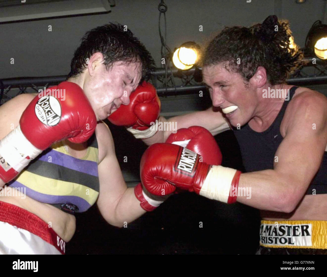 Jane Couch (right) on her way to a win as the referee stops the fight in Round 7. Jane Couch (World Champion) from Bristol and Borislava Goranova (Bulgarian Champion) clashing in their non-title light welterweight eight round fight at the Marriott Hotel. Jane has twice before beaten tonight's opponent. In 1998 with the backing of the Equal Opportunities Commission, Jane won a landmark victory against the British Boxing Board of Control to enable her to gain a licence to box in Britain. Jane's next fight is due in May and talks are continuing about a possible clash with Laila Ali. Stock Photo