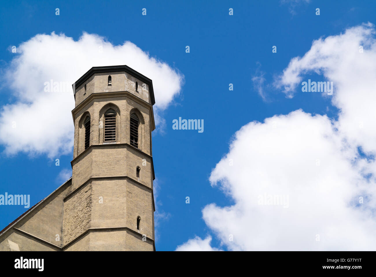 Top of bell tower of Minorite church on Minorites Square in inner city of Vienna, Austria Stock Photo