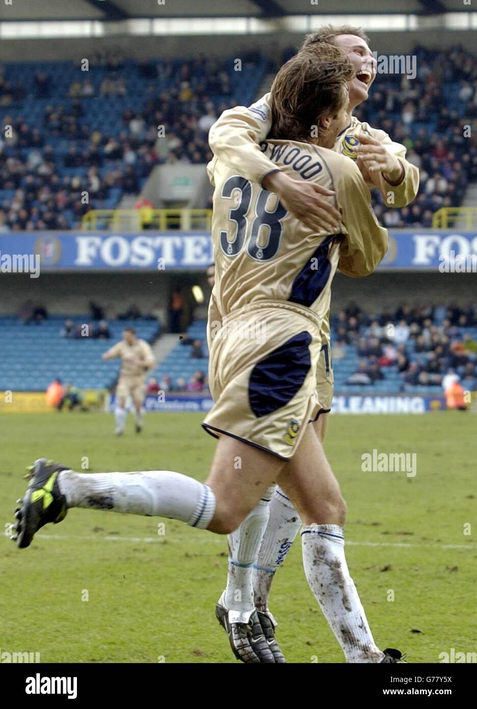 Portsmouth's Tim Sherwood (L) celebrates his side's third goal against Millwall with team-mate Matthew Taylor during the Nationwide Division One match at The Den, London. NO UNOFFICIAL CLUB WEBSITE USE. Stock Photo