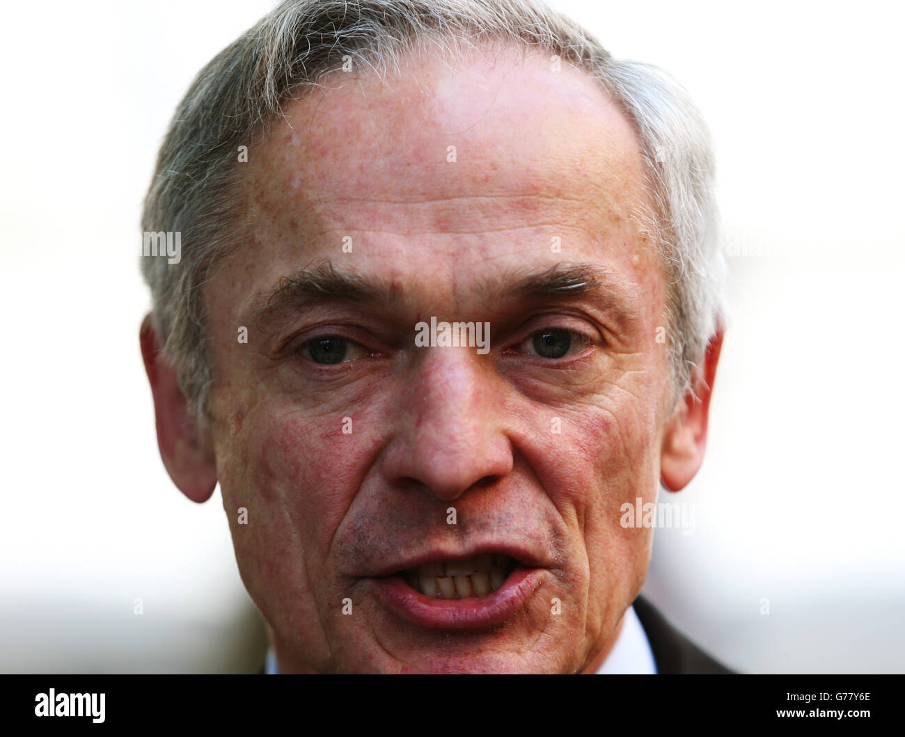 Jobs Minister Richard Bruton during a press briefing outside the Department of Jobs, Enterprise & Innovation on Kildare Street, Dublin, where he defended luring companies to Ireland after US president Barack Obama accused multinationals of relocating to exploit unpatriotic tax loopholes. Stock Photo