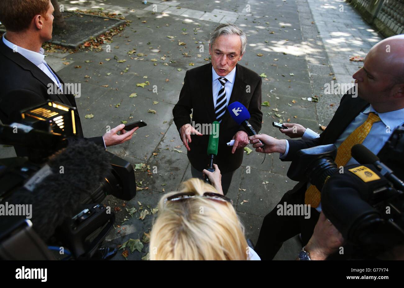 Jobs Minister Richard Bruton during a press briefing outside the Department of Jobs, Enterprise &amp; Innovation on Kildare Street, Dublin, where he defended luring companies to Ireland after US president Barack Obama accused multinationals of relocating to exploit unpatriotic tax loopholes. Stock Photo