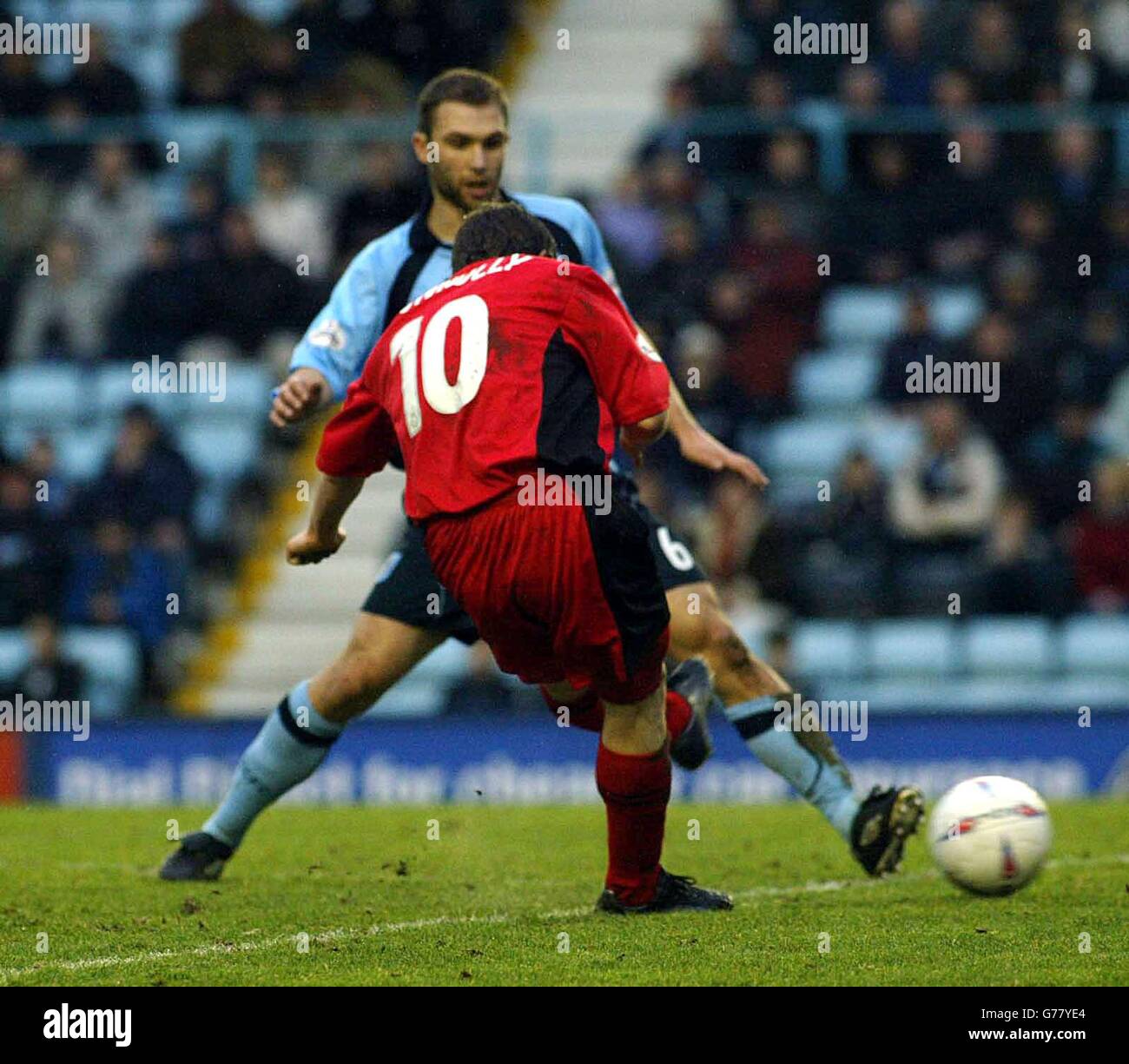 David Connolly of Wimbledon taking a successful shot on the Coventry goal, during the Nationwide Division One match at The Highfield Road Stadium, Coventry. NO UNOFFICIAL CLUB WEBSITE USE. Stock Photo
