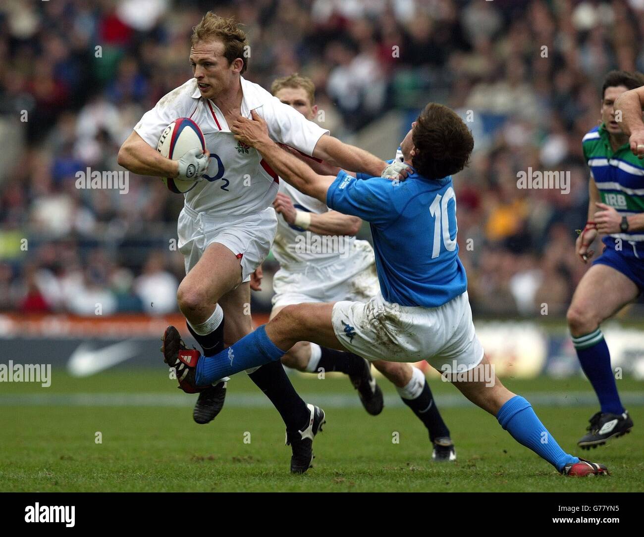 RBS 6 Nations - England v Italy. England's Matt Dawson hands off the tackle of Italy's Ramiro Pez during their RBS 6 Nations match at Twickenham. Stock Photo