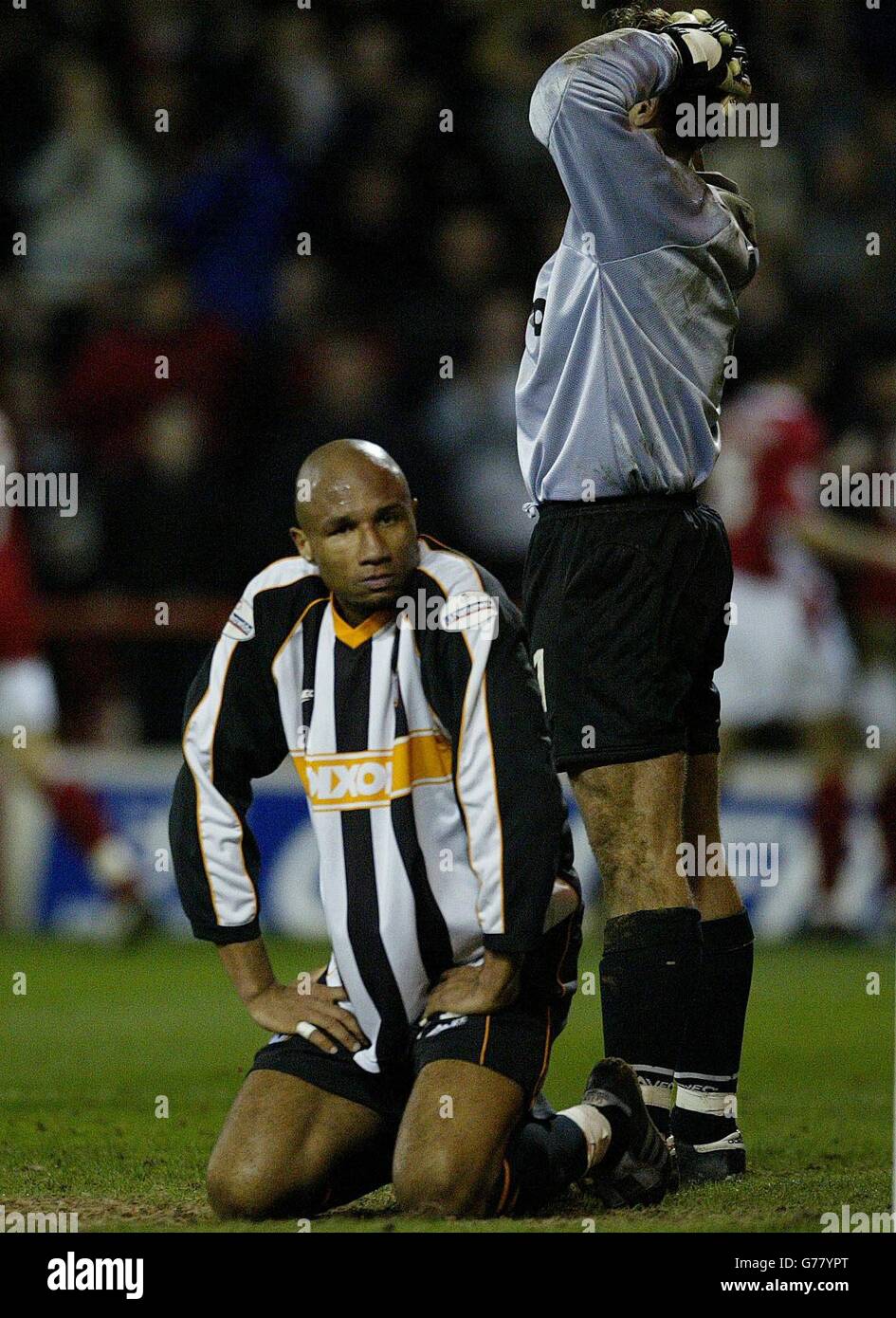 Grimsby Town's Georges Santos (left) and keeper Danny Coyne after Nottingham Forest's Gareth Williams scored an equaliser, bringing the score to 2-2, during the Nationwide Division One match at The City Ground. NO UNOFFICIAL CLUB WEBSITE USE. Stock Photo