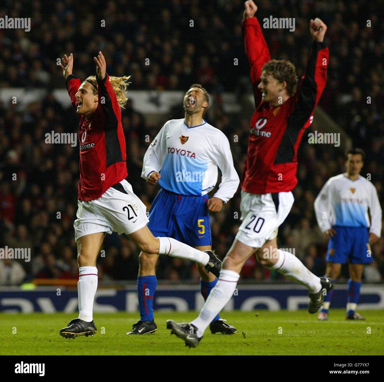 Manchester United's Diego Forlan and Ole Gunnar Solskjaer celebrate Gary  Neville's goal against Basel with Marco Zwyssig (centre), during their  Champions Leage 2nd Rd Group D match at Old Trafford. NO PUBLICATION