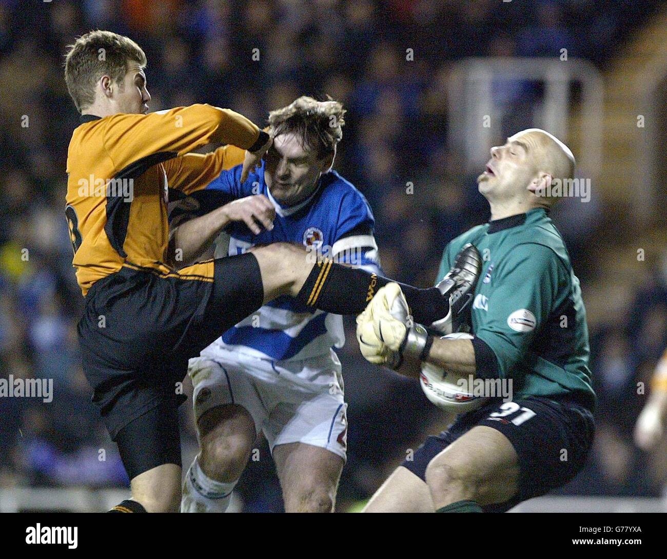 Wolverhampton Wanderers' striker Kenny Miller rises a foot to challenged for the ball as Reading keeper Marcus Hahnemann trys to collect, with defender Steve Brown in close contention, during their Nationwide Division One match at The Madejski Stadium. . Stock Photo