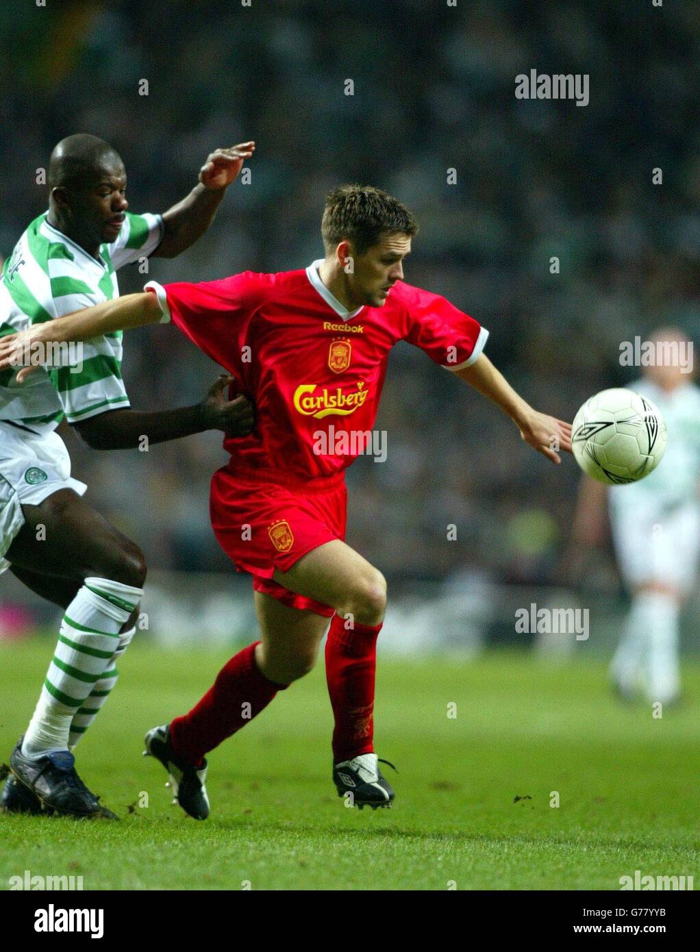 Celtic's Bobo Baldie takes on Michael Owen, during their UEFA Cup quarter-final 1st leg match at Celtic Park, Glasgow. Stock Photo