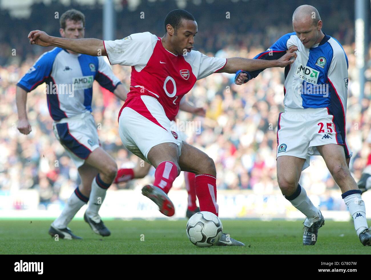 Arsenal's Thierry Henry battles with Blackburn's Henning Berg during the Barclaycard Premiership match at Ewood Park, Blackburn. Stock Photo