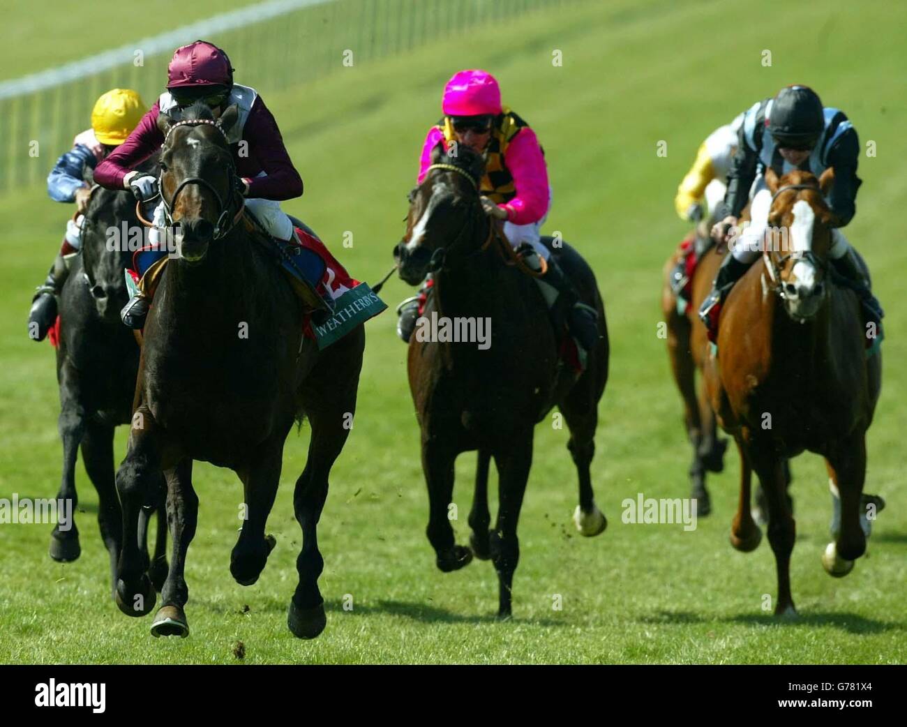 Olden Times (front left), ridden by Kieren Fallon, on his way to winning The Weatherbys Earl of Sefton Stakes over the Rowley Mile racecourse at Newmarket. Stock Photo