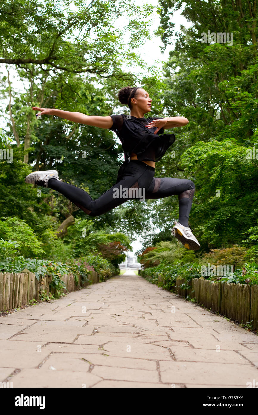 jazz dancer making a leap outdoors Stock Photo