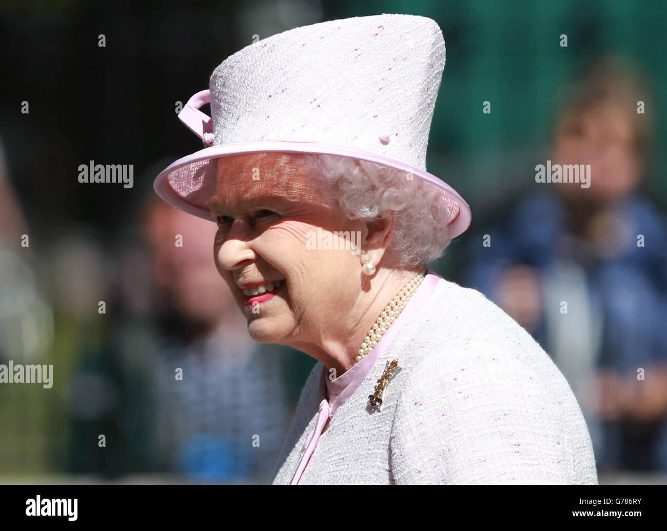 Queen Elizabeth II as she inspects the Argyll and Sutherland Highlanders at the gates to Balmoral as she takes up summer residence there. Stock Photo