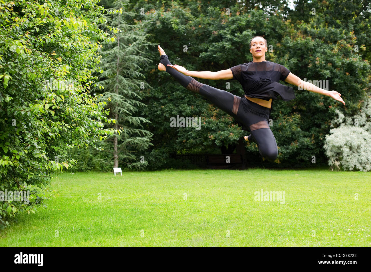 A jazz dancer performing a jump Stock Photo