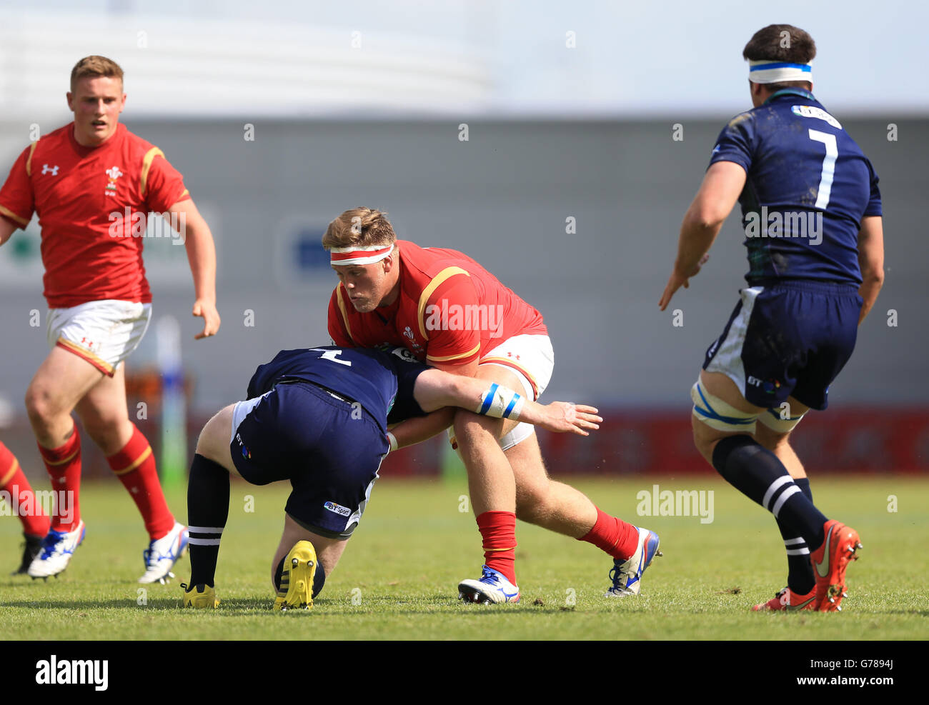 Scotland's Lewis Anderson (left) tackles Wales' Corey Domachowski ...