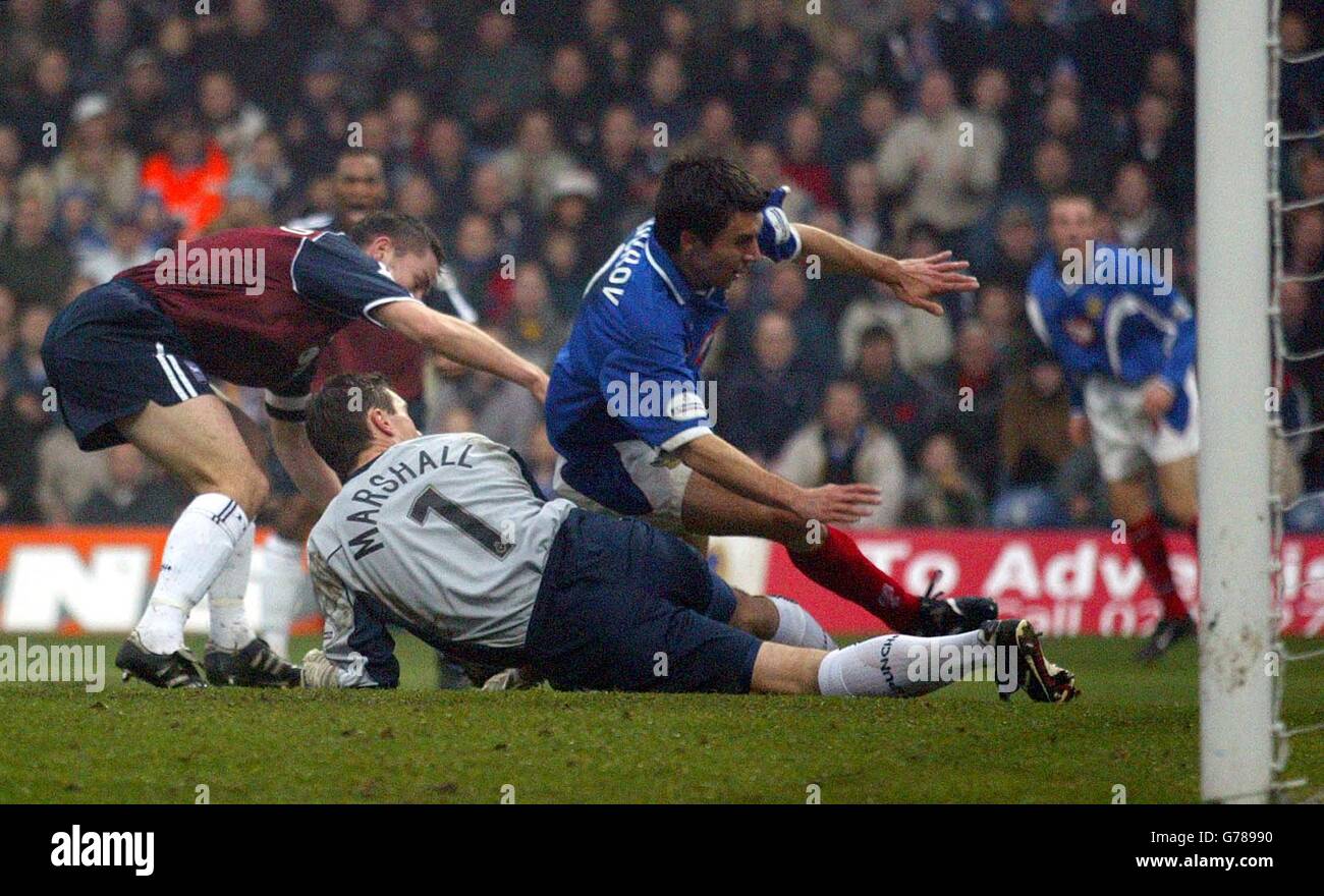 Svetoslav Todorov of Portsmouth scores the opening goal against Ipswich ...