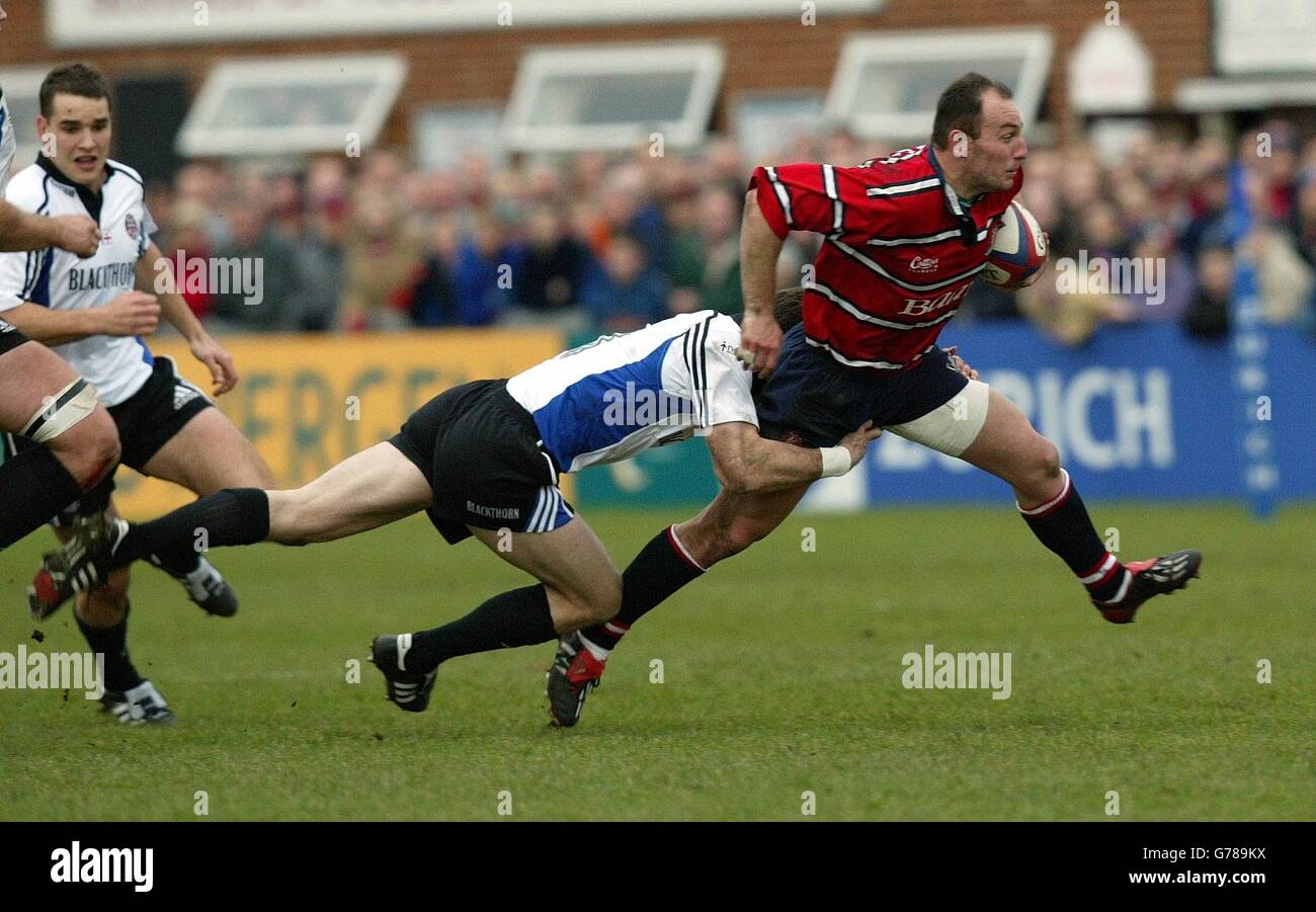 Gloucester v Bath Mercier. Gloucester's Ludovic Mercier (right) is tackled by Bath's Mike Catt during the Zurich Premiership match at Gloucester's Kingsholm stadium. Stock Photo
