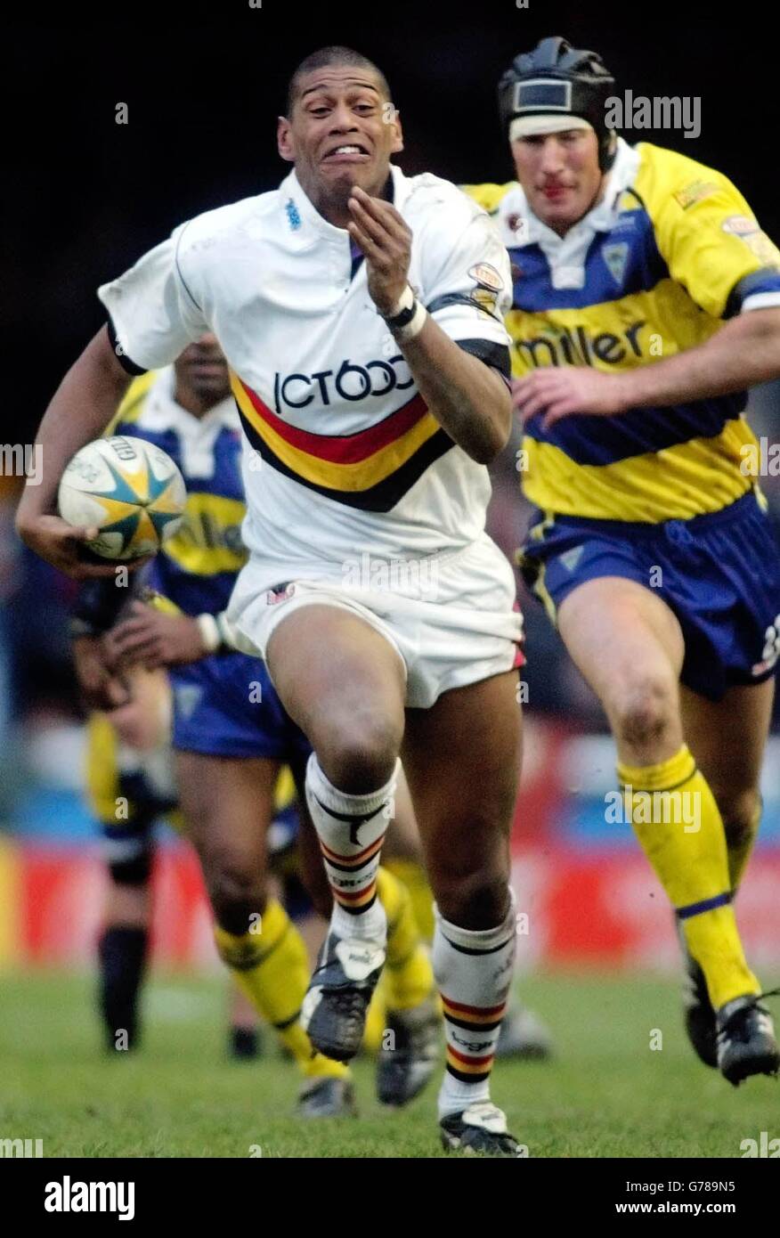 Bradford's Leon Pryce (left) gets away from Warrington's Mike Wainwright on his way to scoring a try during their Powergen Challenge Cup Fourth Round match at the Wilderspool stadium, Warrington. 20/10/03: Leon Pryce (left) appeared at Teeside Crown Court. Pryce, 22, pleaded guilty to unlawful wounding following an attack on Edward McGuinness, a coach with Salford Reds. The Bradford Bulls player, who came on as a substitute during Saturday's Grand Final win over Wigan Warriors, had denied a charge of unlawful wounding with intent and his guilty plea to the lesser charge was accepted by the Stock Photo