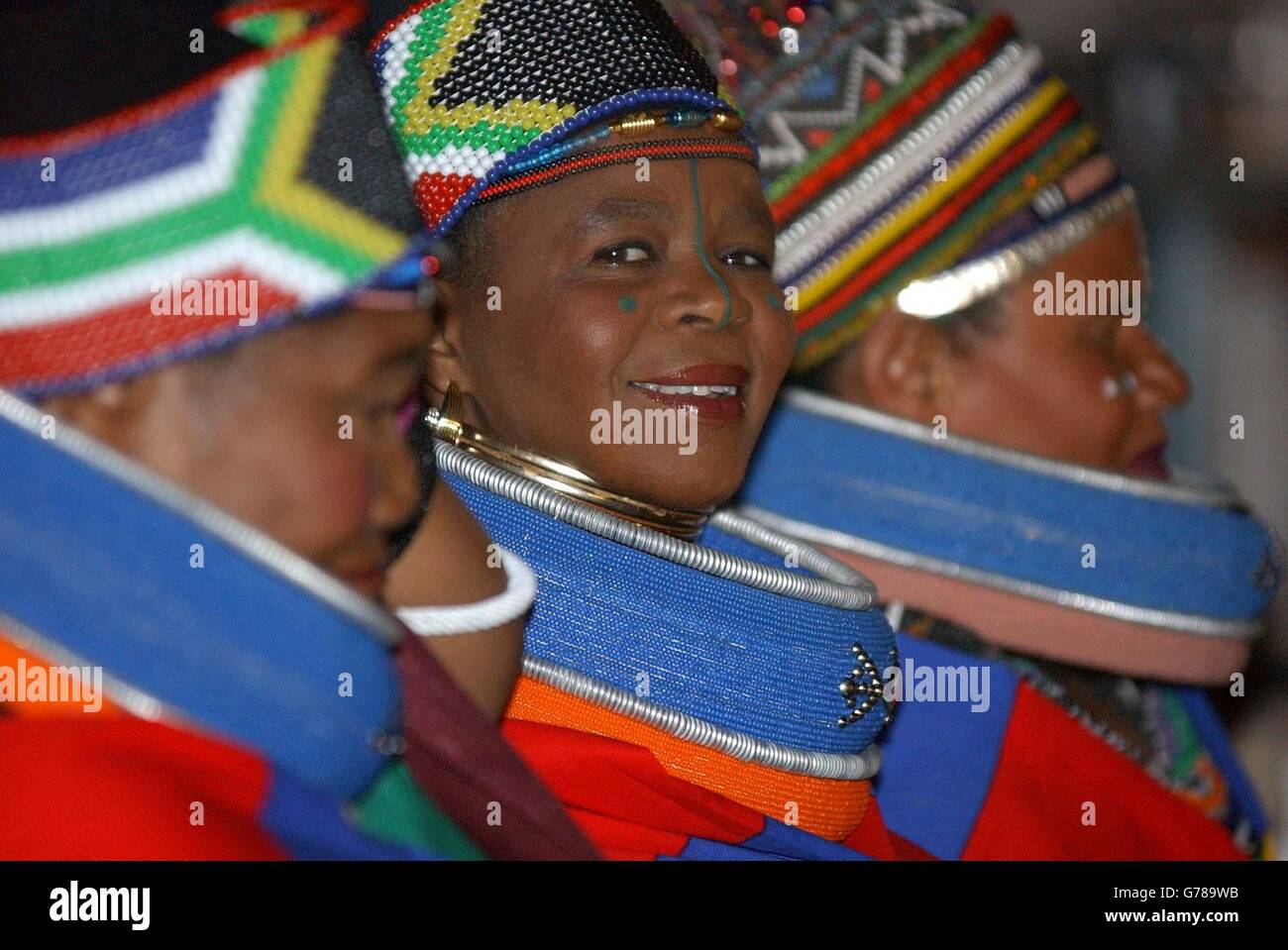 - NO COMMERCIAL SALES: A lady in coloured clothing smiles during the opening ceremony of the Cricket World Cup 2003 at Newlands, Cape Town, South Africa. Jungle and safari themes dominated at Newlands during an extravaganza featuring remote-controlled guinea pigs, several million different-shaped beads and more wild animals than you could hope to count. Stock Photo