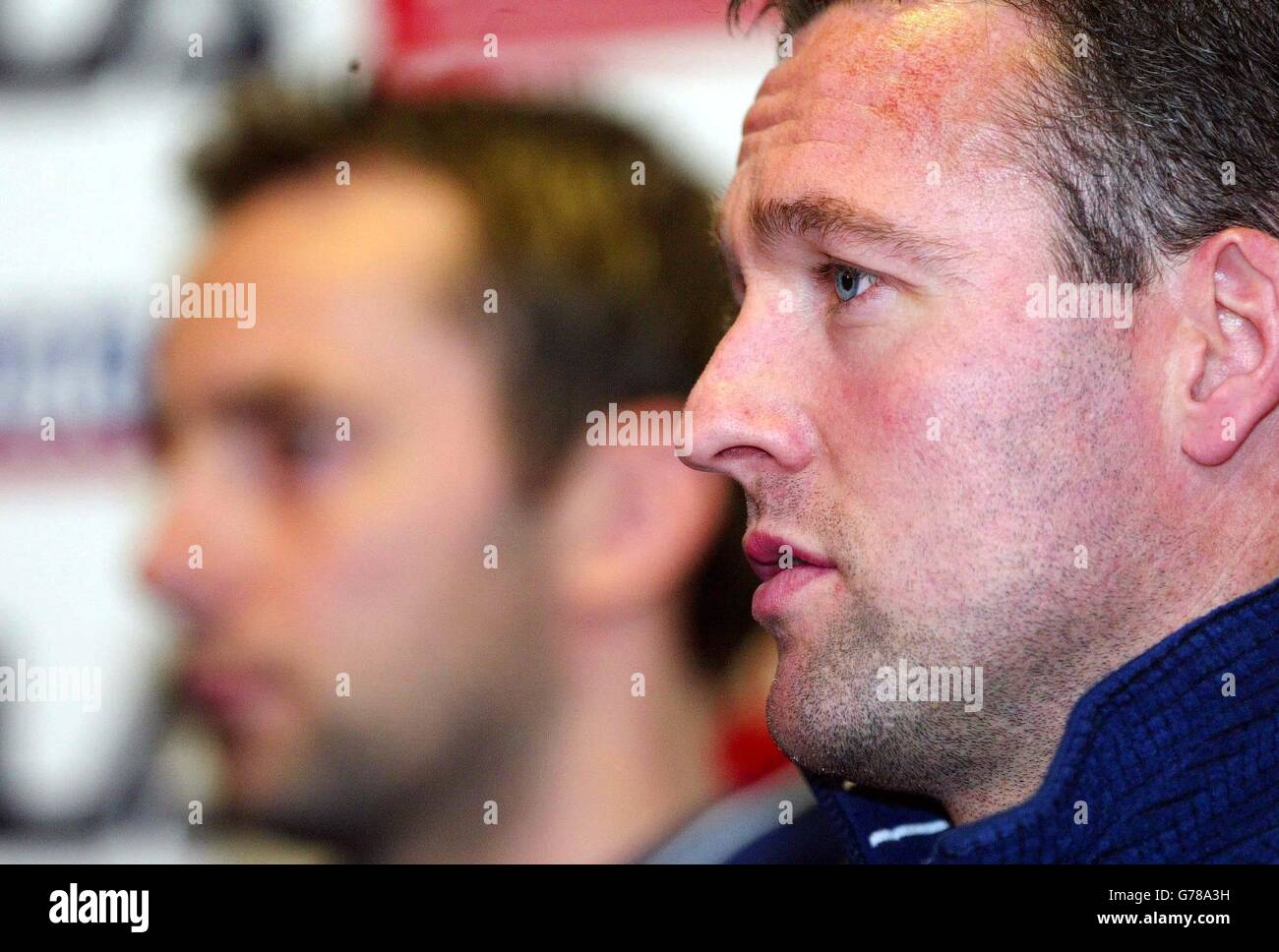 Celtic team captain Paul Lambert talks to the press during a pre match conference at Hampden park with Don Hutchison (behind) for the up and coming international game against the republic of Ireland. Stock Photo