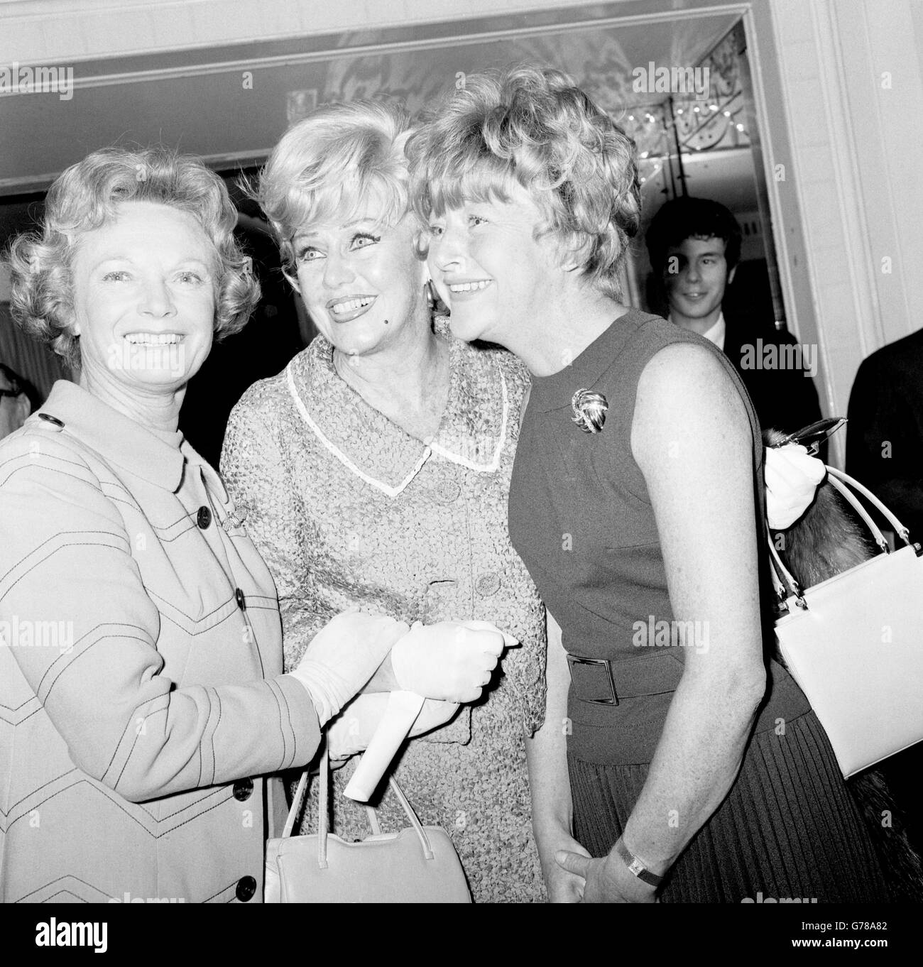 (l-r) Actresses Anna Neagle, Ginger Rogers and Dora Bryan at a variety club luncheon at the Dorchester Hotel. The event was held in honour of Rogers, who is currently playing the title role in Mame at the Theatre Royal. Stock Photo