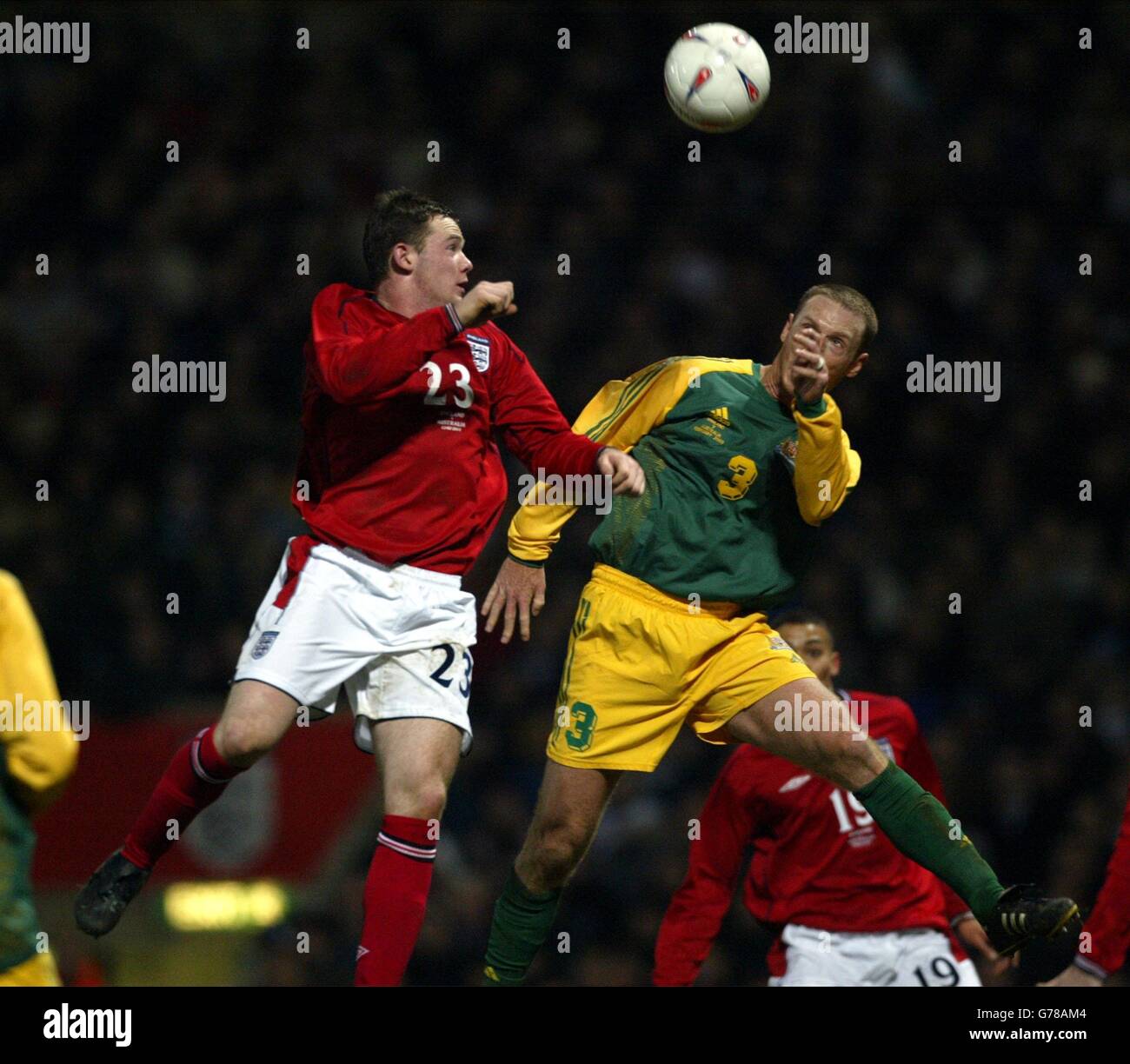 England's Wayne Rooney (left) battles for the ball against Australia's Craig Moore during the friendly International match against Australia at Upton Park, east London. Australia defeated England 3-1. Stock Photo