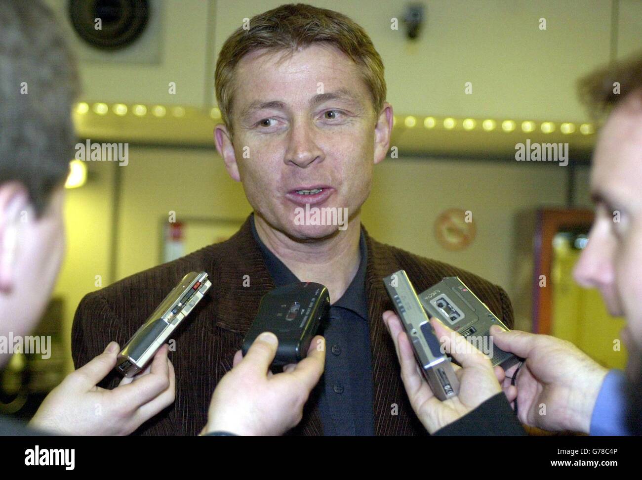 Iceland coach Atli Edvaldsson arrives with his team at Glasgow Airport, Glasgow, for their 2004 Euro Qualifier against Scotland this weekend. Stock Photo