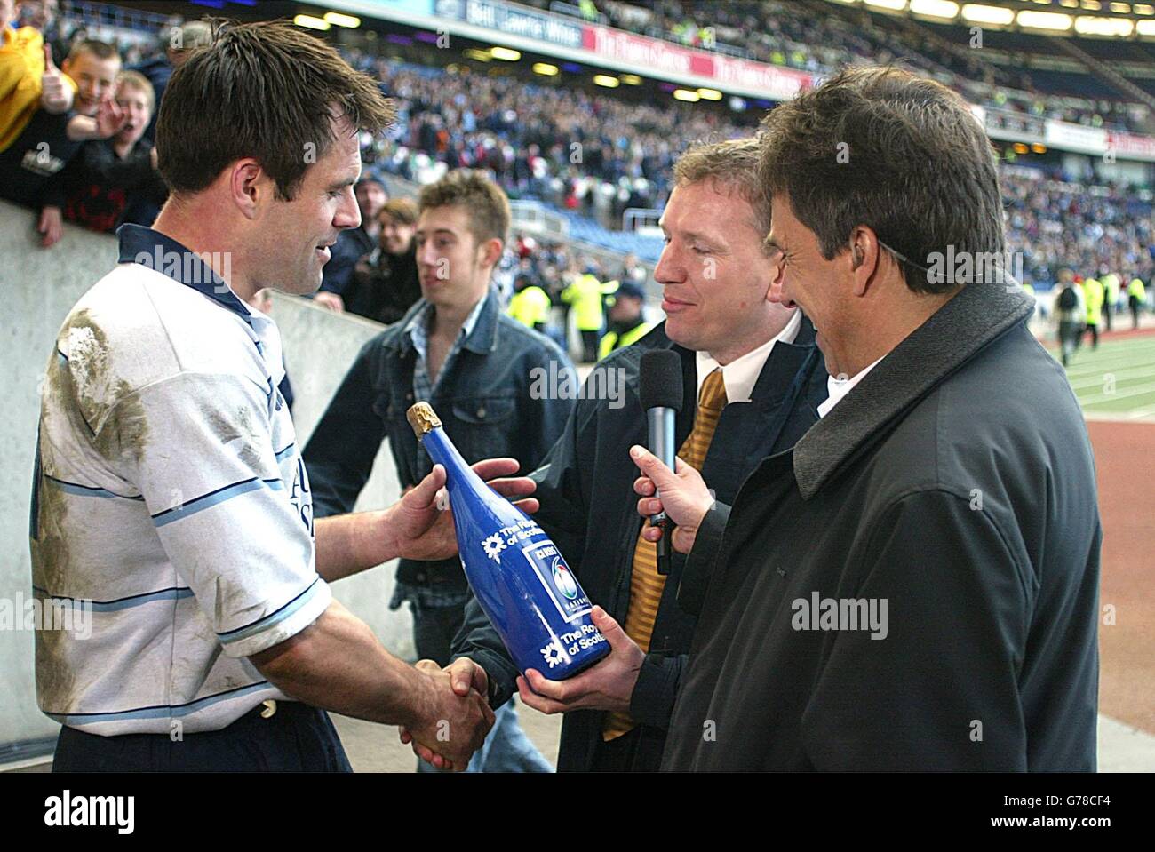 Scotland's Kenny Logan is awarded "Man of the Match" by Andy Nichol