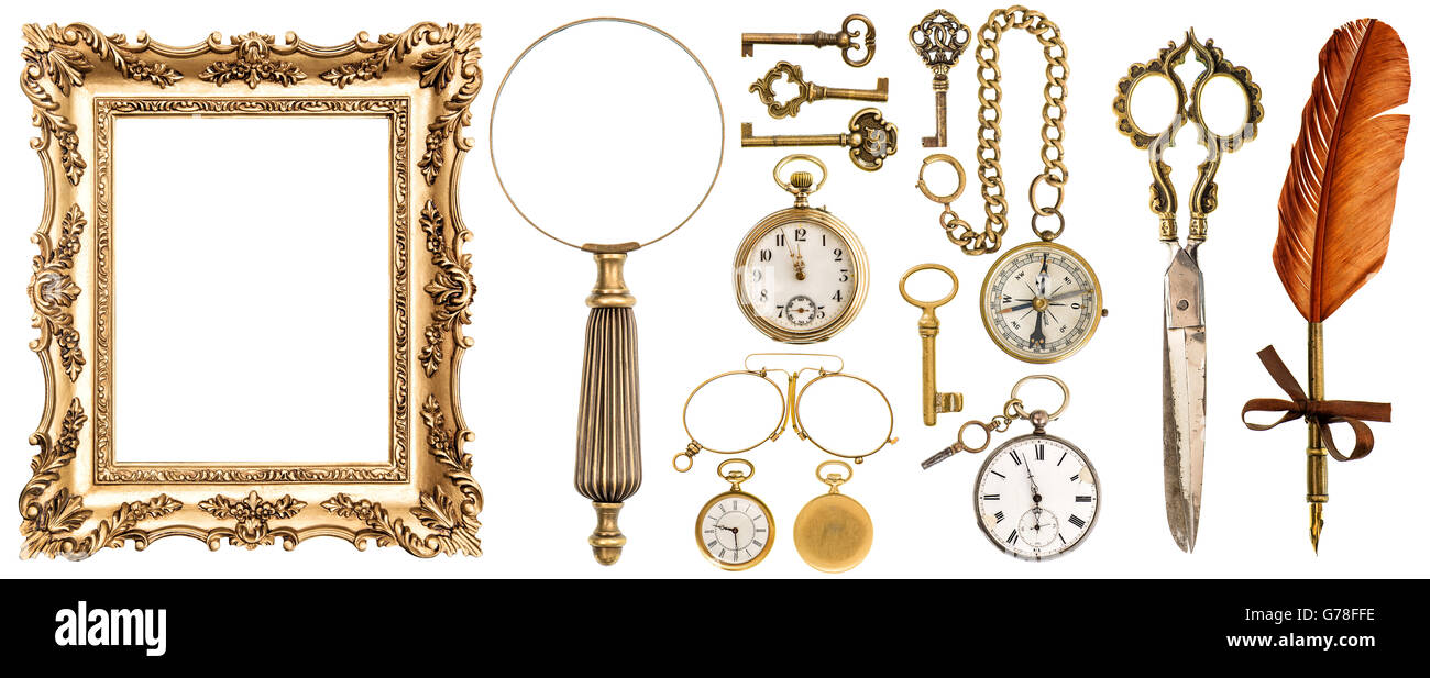 Collection of golden vintage accessories and antique objects. Old keys, picture frame, clock, loupe, compass, ink feather pen, s Stock Photo