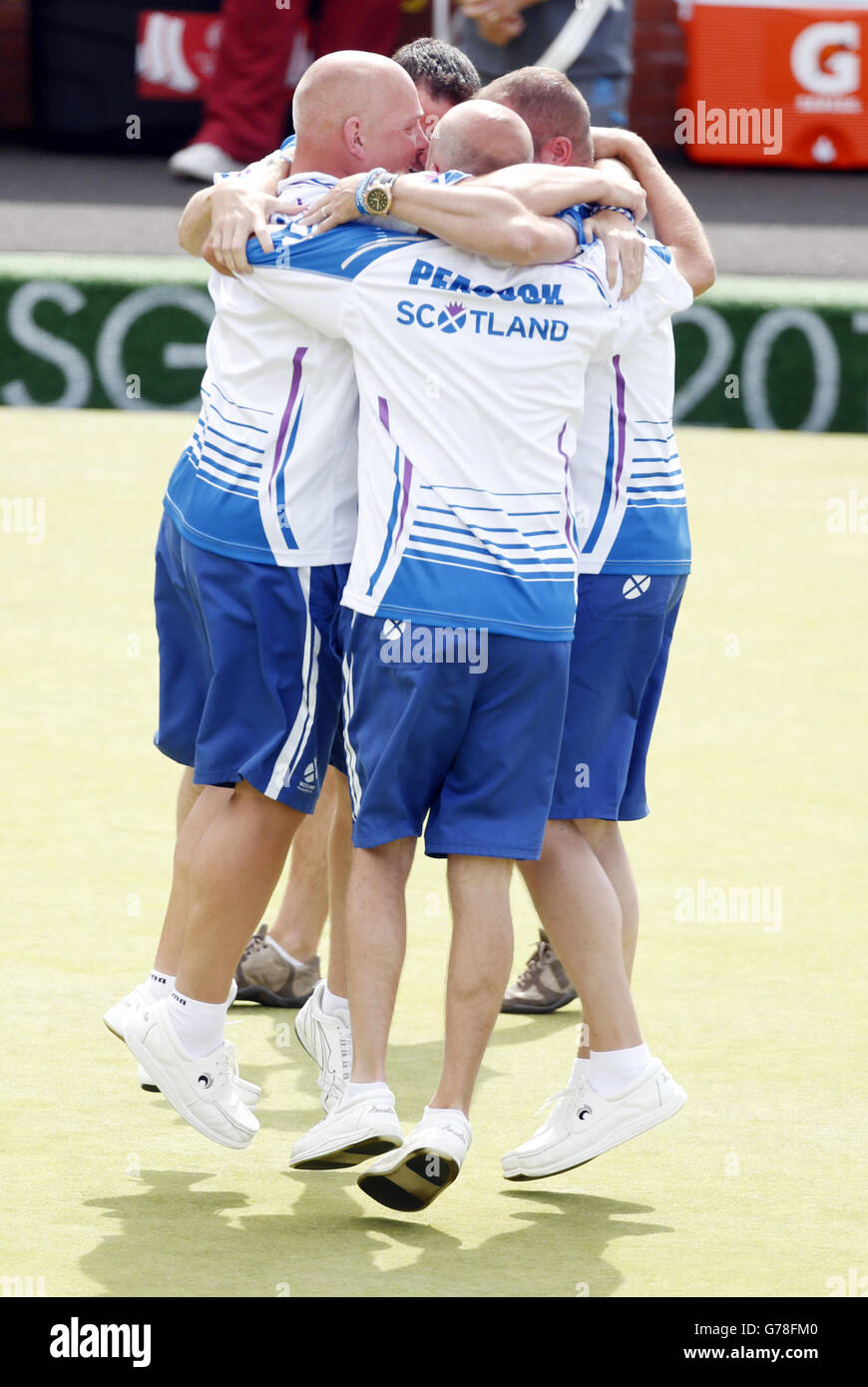 Sport - 2014 Commonwealth Games - Day Nine. Scotland's Paul Foster, Alex Marshall, David Peacock and Neil Speirs celebrate winning Gold in the Men' Fours Stock Photo
