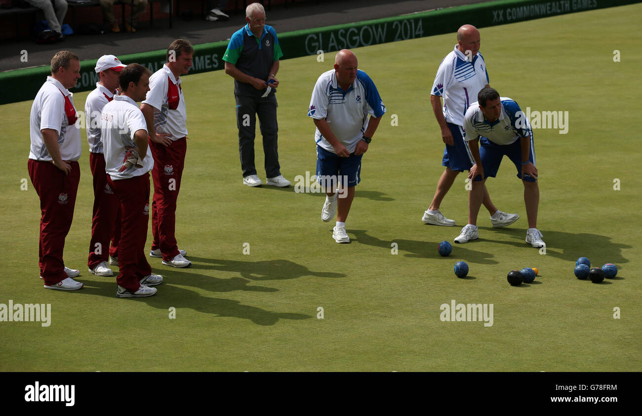 Scotland's Alex Marshall, Neil Speirs and David Peacock view a shot against England in the Men's Fours final at Kelvingrove Lawn Bowls Centre, during the 2014 Commonwealth Games in Glasgow. Stock Photo
