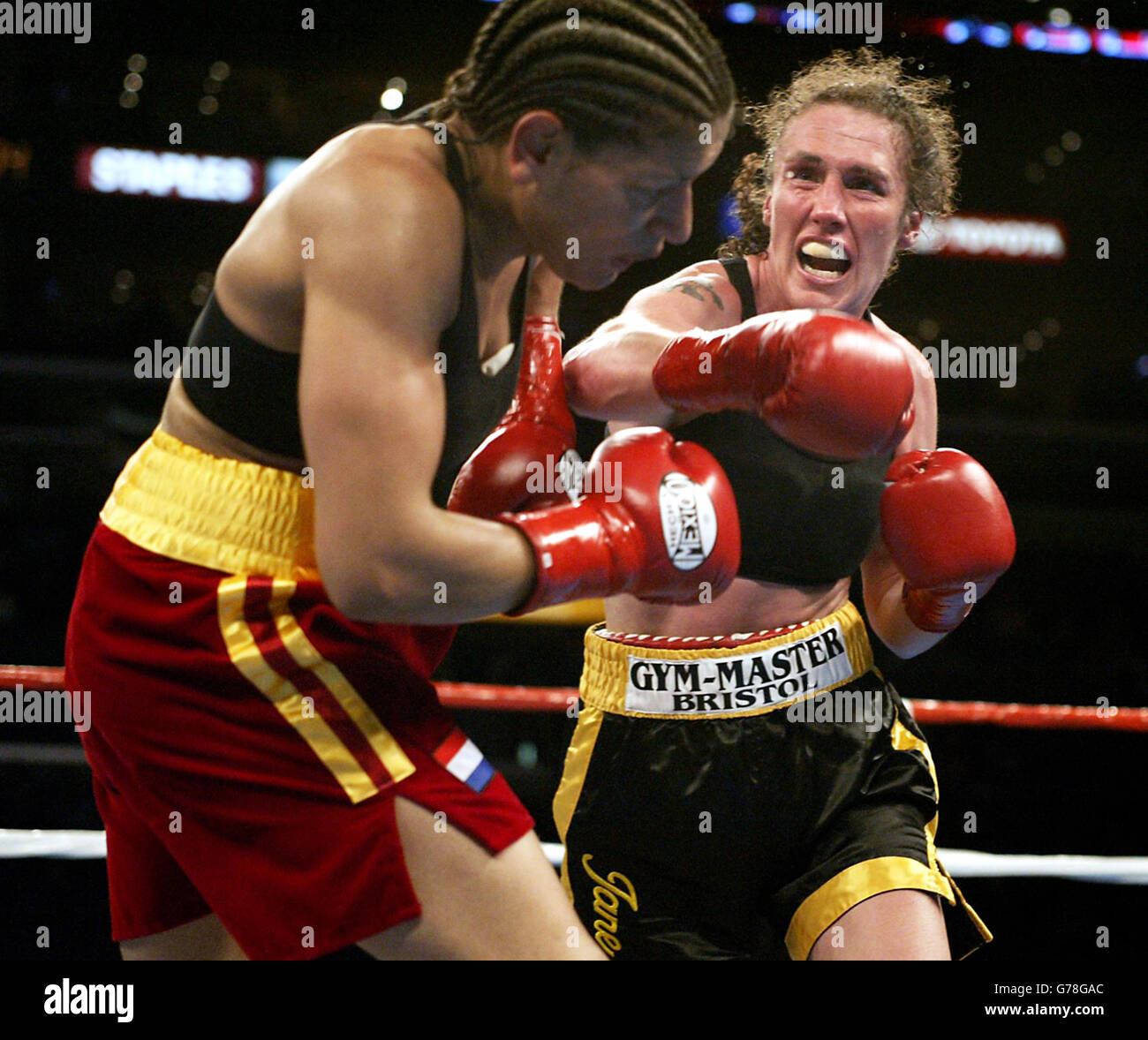 Britain's Jane Couch (right) lands a right hand punch to the head of American Lucia Rijker, during Couch's points defeat at Junior Middleweight at the Staples Centre Arena in Los Angeles. Stock Photo