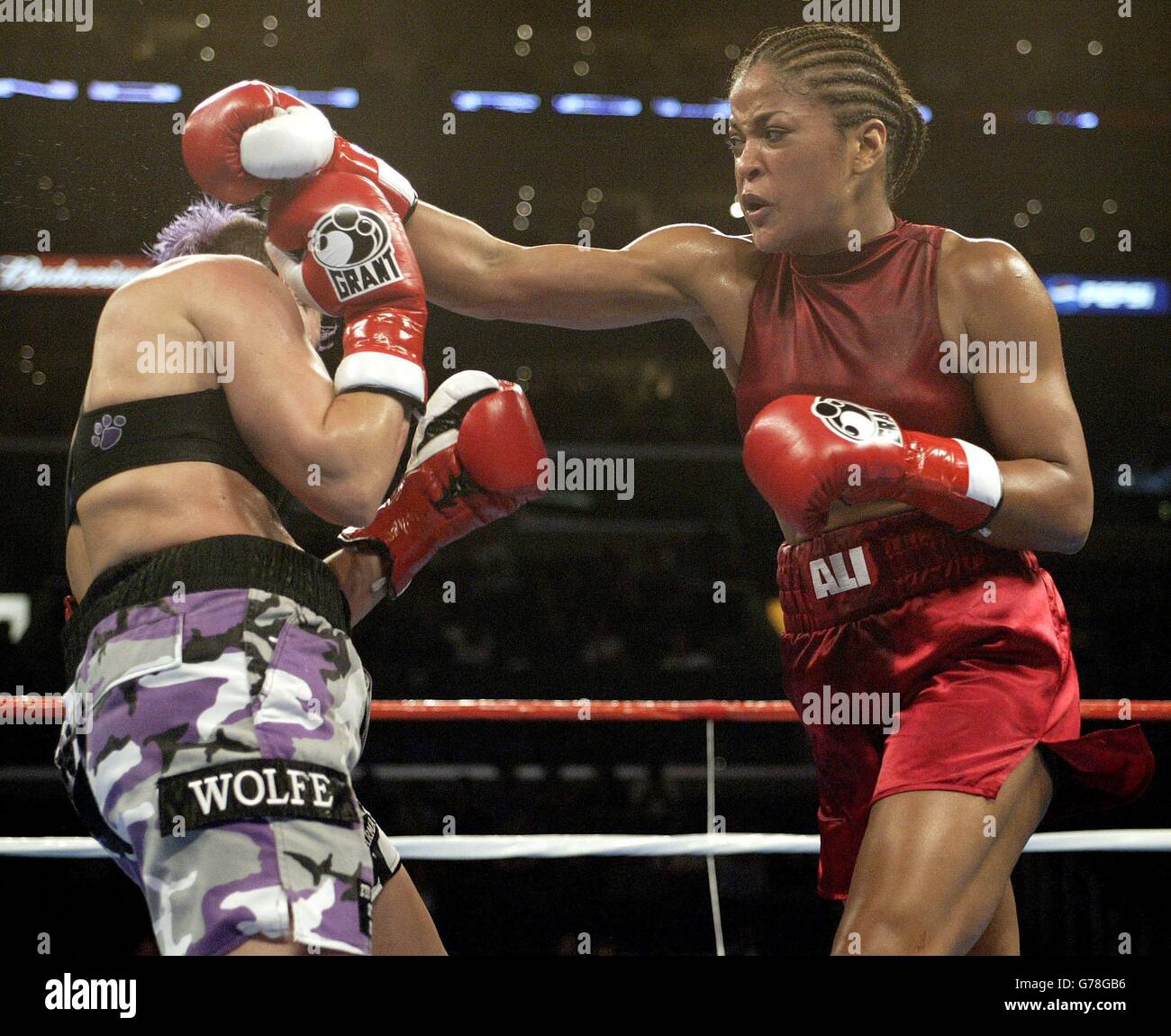 Muhammed Ali's daughter Laila Ali (right) lands right hand punch to Valerie Mahfood, during Ali's 6th round TKO victory in Super-Middleweight at the Staples Centre Arena in Los Angeles. Stock Photo