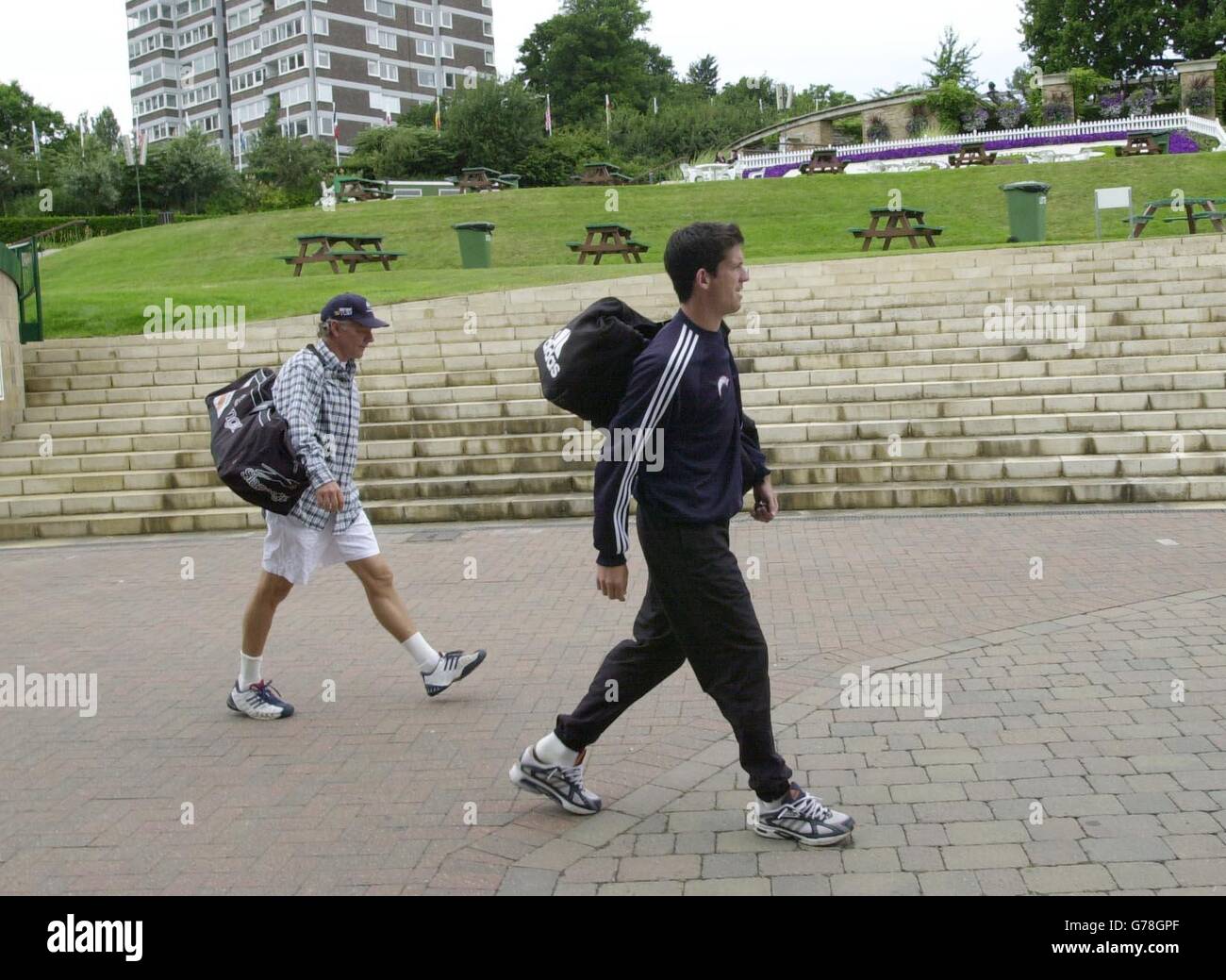 , NO MOBILE PHONE USAGE Tim Henman walks past 'Henman Hill' at the All England Club in South London, as final preparations are made before the start of the Wimbledon tennis Championships 2003. Stock Photo
