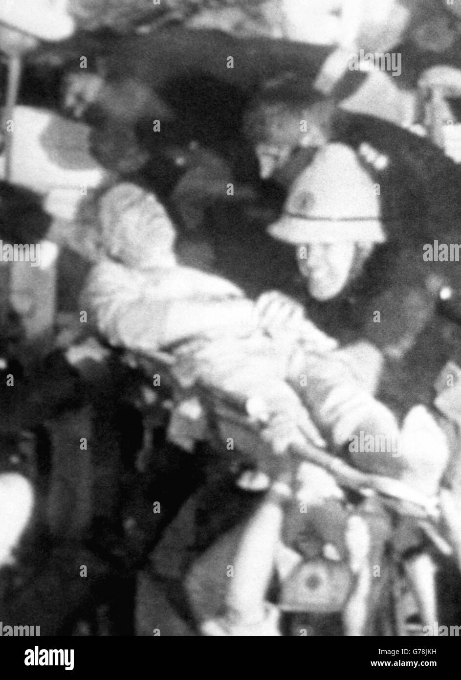 Trade and Industry Secretary Norman Tebbitt (l), 53, as seen on BBC TV News being rescued by firemen from the rubble of the Brighton Grand Hotel IRA bomb blast. Stock Photo