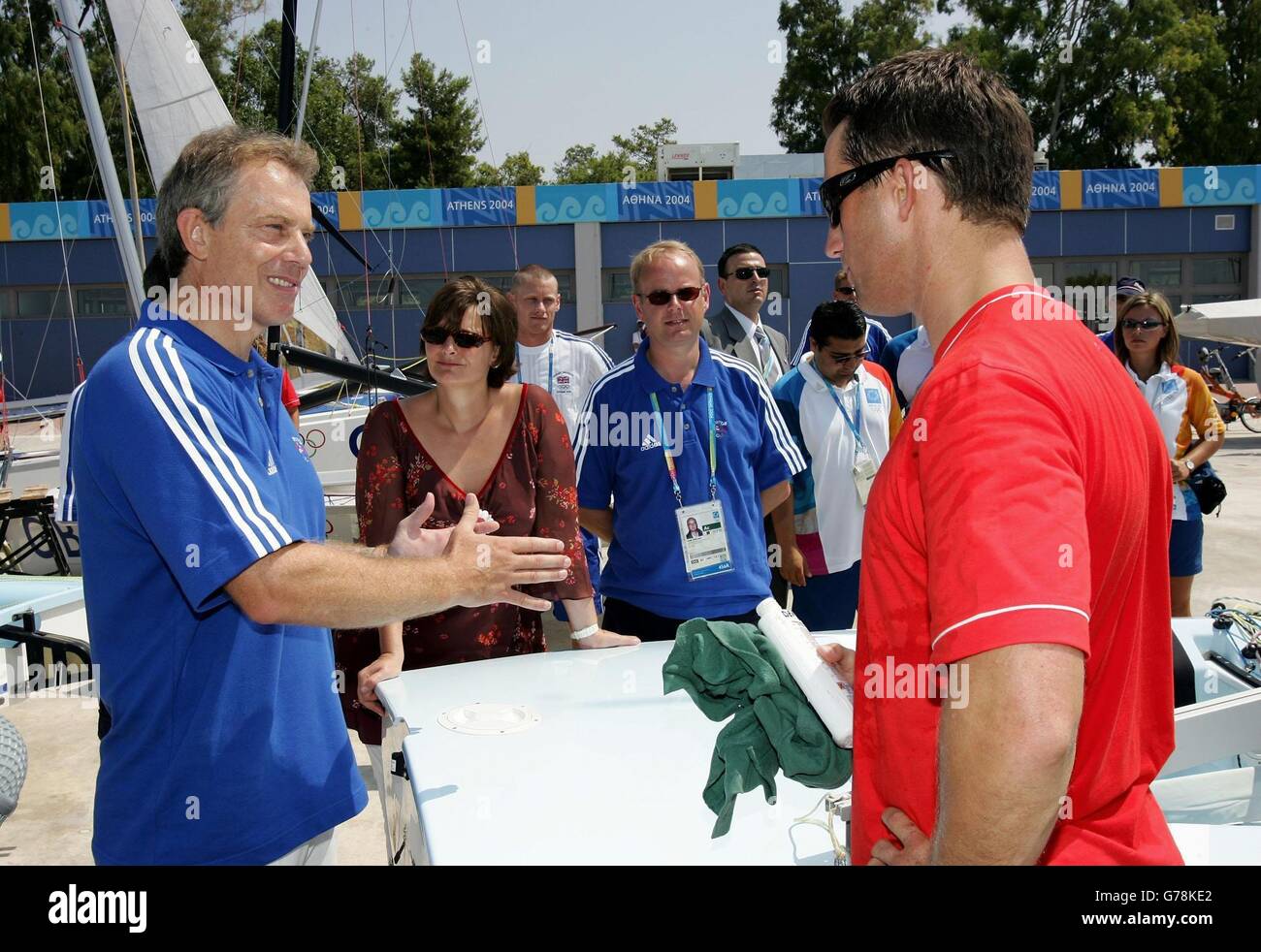 Prime Minister Tony Blair (left) and his wife Cherie (to his right) meet with members of the Great Britain Olympic Sailing team at the Agios Kosmas Olympic Sailing Centre prior to the start of the Athens 2004 Summer Olympic Games in Athens, Greece. Mr Blair, attending the opening ceremony for the Olympics as part of a tour, will be staying on the worlds largest cruise liner the Queen Mary 2. He said it would be 'fantastic' if London won the race to stage the 2012 games. Stock Photo