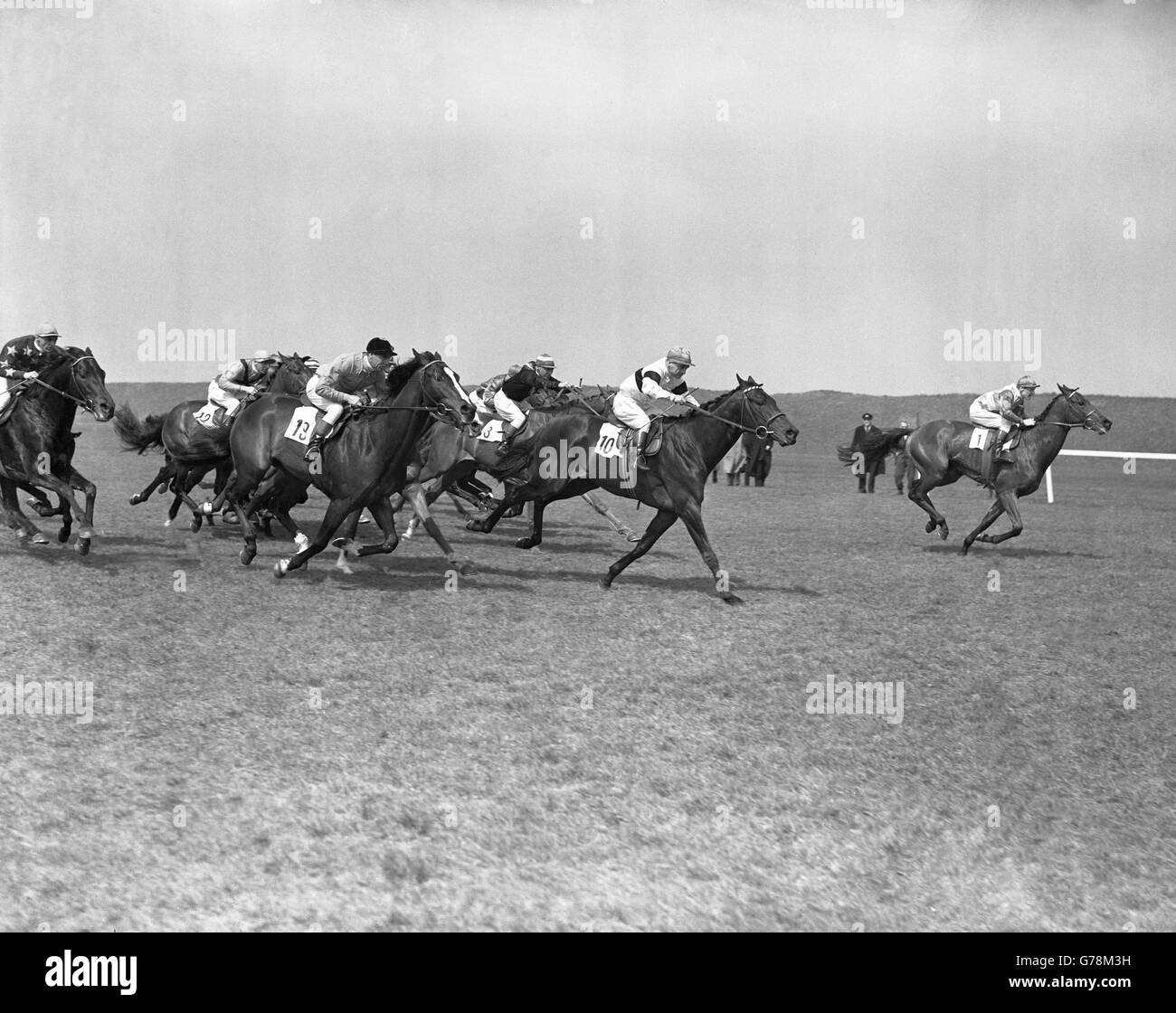 The new two thousand guineas stakes approaching the rails. Mr Bassett's 'Mr Sawyer' (1) leads from Mrs MacDonald Buchanan's 'Owen Tudor' (10) and the winner, Duke of Westminster's 'Lambert Sinnel' (19). Stock Photo